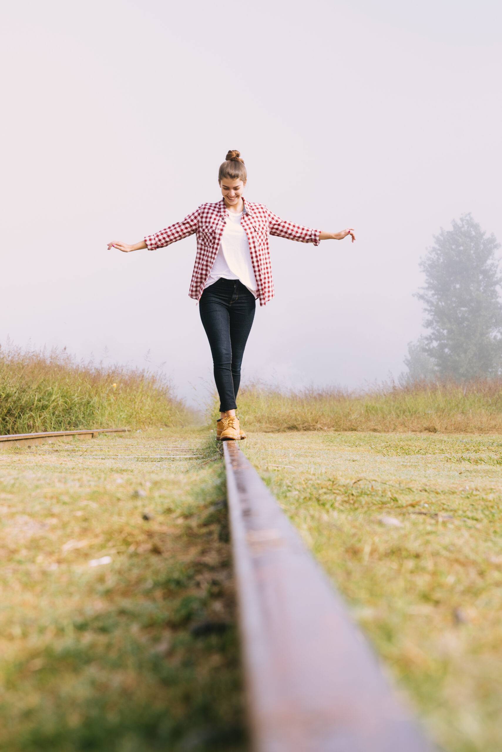 Home Low Angle Young Girl Balancing Railway Scaled