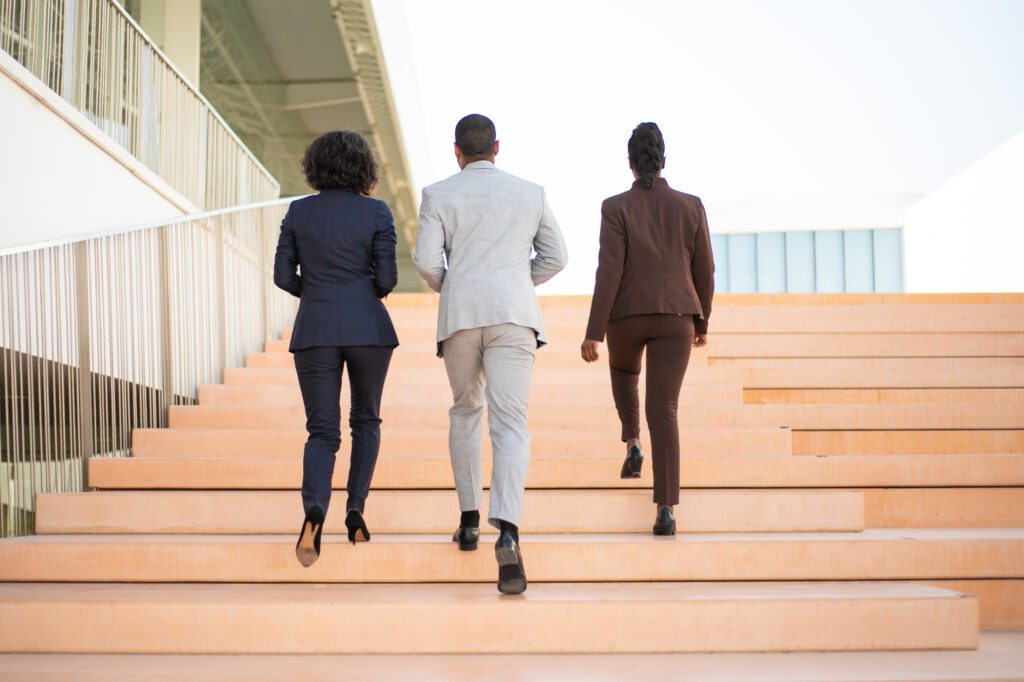 businesspeople walking near office building