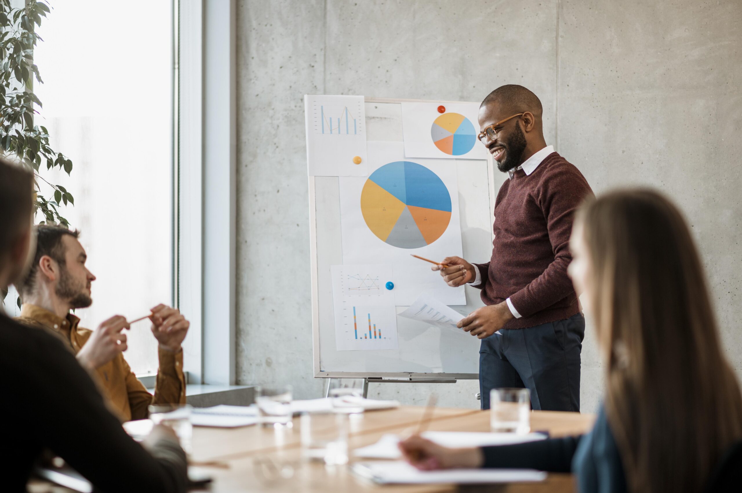 smiley man doing presentation meeting